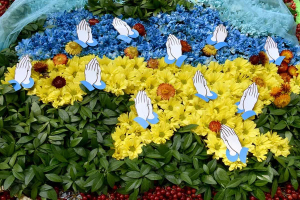 Map of Ukraine with flowers in blue and yellow colors of the nat