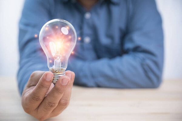 Idea Concept Inspiration Innovation Businessman Holding Bright Light Bulb Copy — Stock Photo, Image