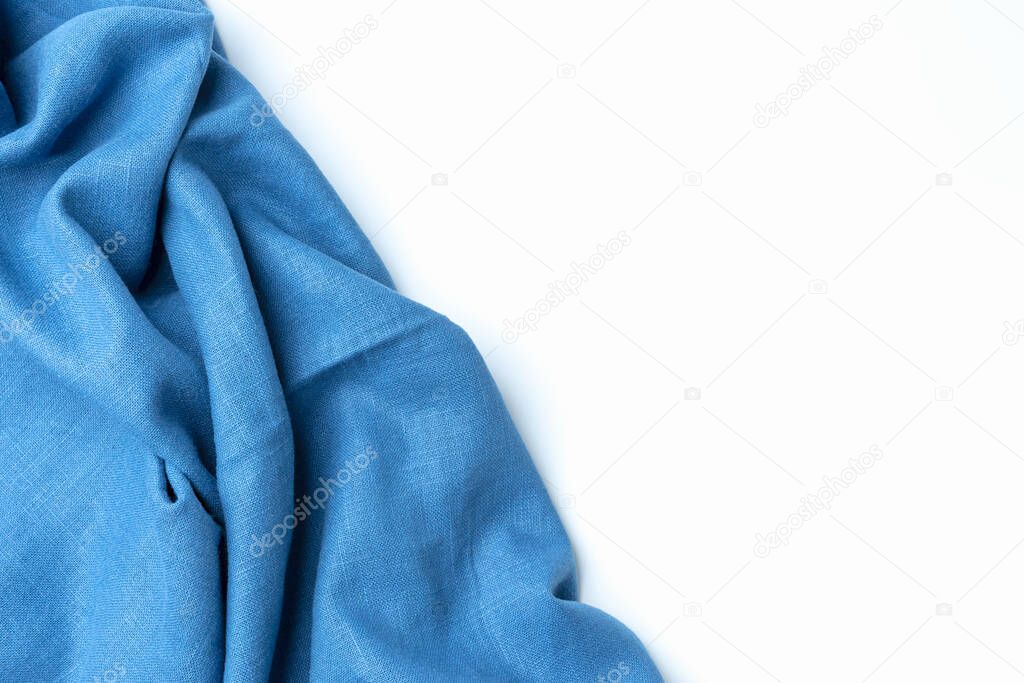 Cotton textile is wave beautiful for wallpaper. Top view blue fabric luxurious softness smooth on white background with copy space. Design textured, abstract, background.