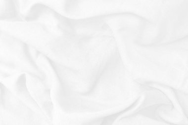 Pamuk tekstil duvar kağıdı için güzel bir dalgadır. Üst görünüm beyaz kumaş lüks yumuşaklık beyaz arkaplanda fotokopi alanı ile pürüzsüz. Desenli, soyut, arkaplan.