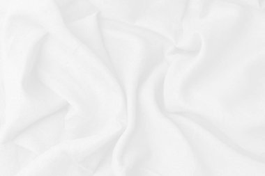 Pamuk tekstil duvar kağıdı için güzel bir dalgadır. Üst görünüm beyaz kumaş lüks yumuşaklık beyaz arkaplanda fotokopi alanı ile pürüzsüz. Desenli, soyut, arkaplan.