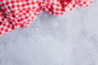 Minimalist Dining Background with Red Tablecloth Accent. A minimalist and clean dining background using the familiar red check pattern. Features a large blank area, copy space for design use.