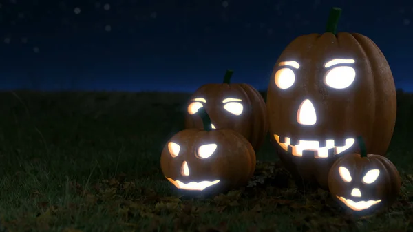 Glowing halloween pumpkins on grass field with dark sky — Stock Photo, Image