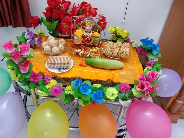 krishna Janmashtami celebration with flowers and balloons decoration