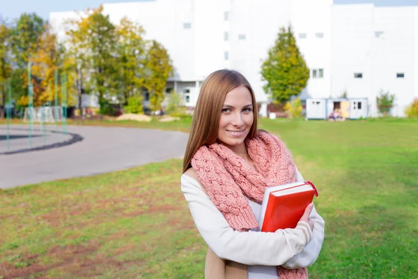 Student wearing scarf and smiling — Stock Photo, Image