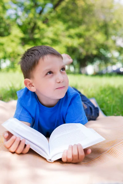 Boy dreaming on the book — Stock Photo, Image