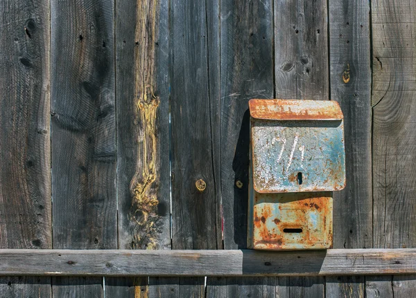 Old mailbox on fence — Stock Photo, Image