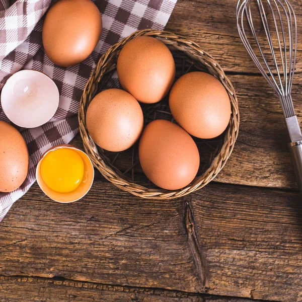 Chicken eggs on wooden background — Stock Photo, Image