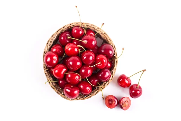 Cerejas agradáveis e suculentas em um fundo branco — Fotografia de Stock