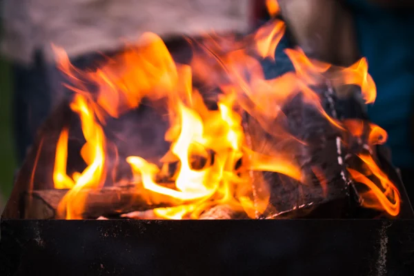 Fire flames with sparks on the coals — Stock Photo, Image