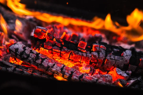 Fire flames with sparks on the coals — Stock Photo, Image