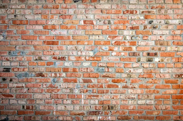 Bakgrund av röd tegelvägg mönster struktur. Perfekt för graffitiinskriptioner. — Stockfoto