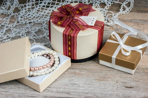 Gift boxes on a wooden background — Stock Photo, Image