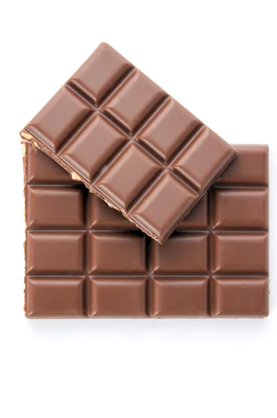 Chocolate com nozes em um fundo branco — Fotografia de Stock