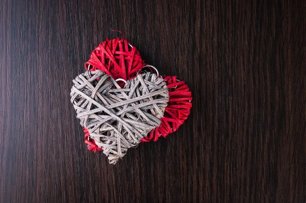 Wooden heart-shaped pattern on the wooden background — Stock Photo, Image