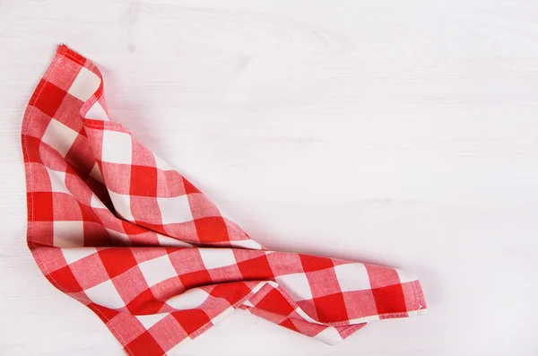 Red checkered napkin on wooden background — Stock Photo, Image