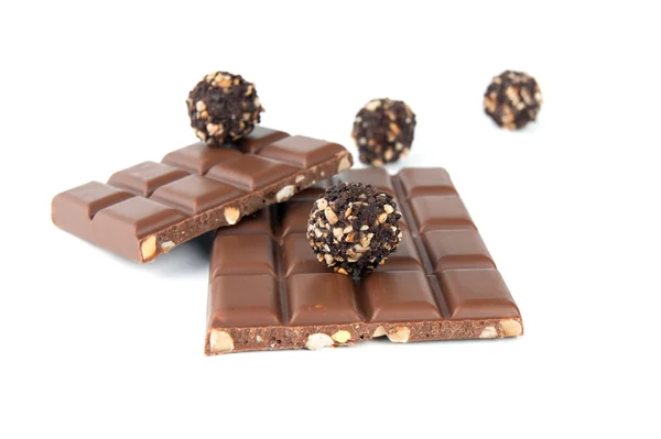 Chocolate with nuts on a white background — Stock Photo, Image