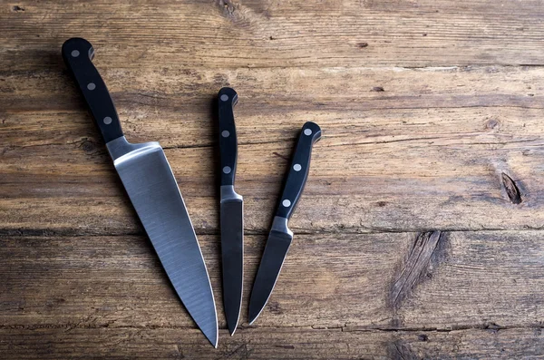 Knife on rustic kitchen table with copy space — Stock Photo, Image