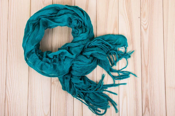 Green scarf on wooden background — Stock Photo, Image