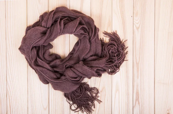 Brown scarf on wooden background — Stock Photo, Image