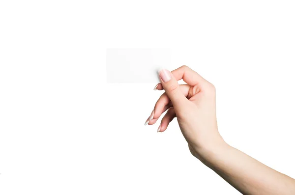 Kvinnlig hand som håller ett tomt visitkort — Stockfoto