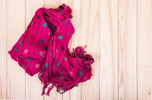 Red scarf on wooden background — Stock Photo, Image