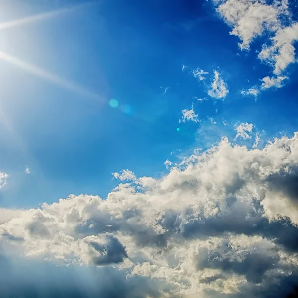 Blue sky, clouds and sun light background — Stock Photo, Image