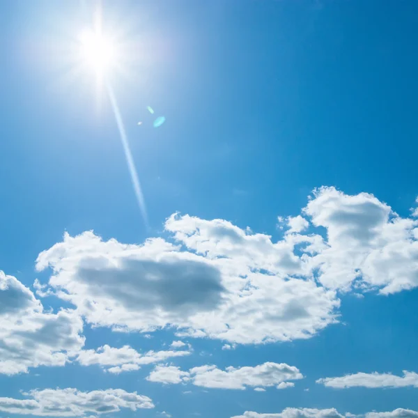 Beautiful blue sky with clouds and sun Stock Picture