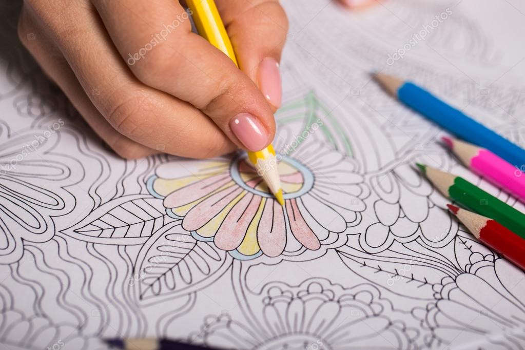 Download Girl Paints A Coloring Book For Adults With Crayons Stock Photo Image By C Ollnka 99682442