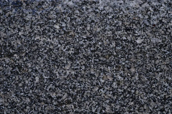 Abstrakter Hintergrund eines grau gefliesten Gehwegs in einem Park — Stockfoto