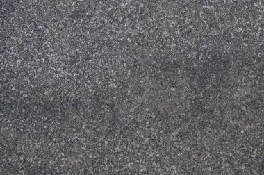 Parktaki gri fayanslı yürüyüş yolunun soyut arkaplanı