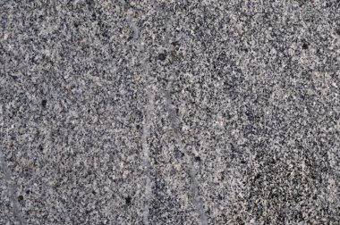 Parktaki gri fayanslı yürüyüş yolunun soyut arkaplanı