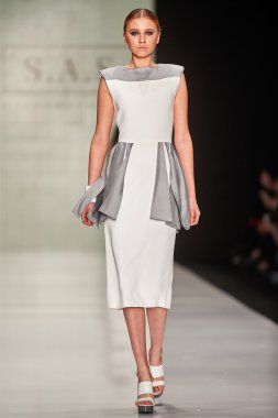 A model walks on the Maison SAS catwalk