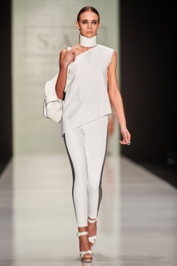 A model walks on the Maison SAS catwalk