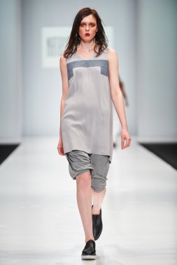 A model walks on the NATASHA DRIGANT catwalk