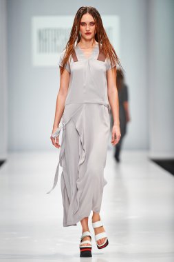 A model walks on the NATASHA DRIGANT catwalk