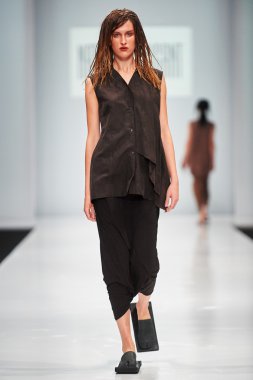 A model walks on the NATASHA DRIGANT catwalk