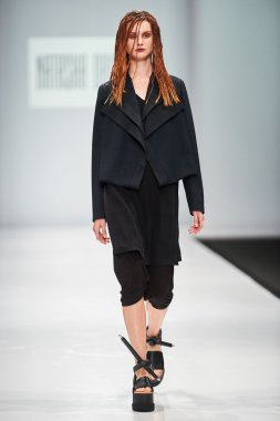A model walks on the NATASHA DRIGANT catwalk