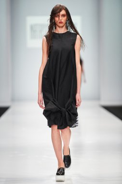 A model walks on the NATASHA DRIGANT catwalk