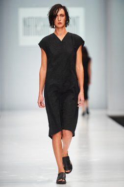 A model walks on the NATASHA DRIGANT catwalk