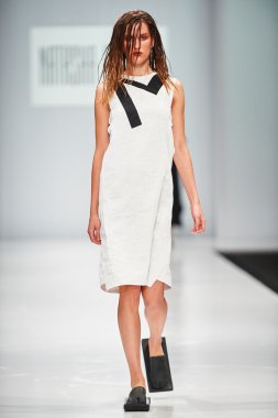 A model walks on the NATASHA DRIGANT catwalk