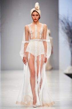 A model walks on the JULIA YANINA catwalk