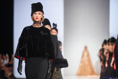 A model walks on the JULIA YANINA catwalk