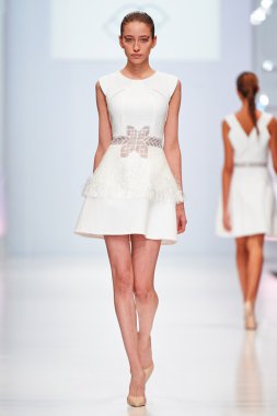 A model walks on the NATALIA GART catwalk