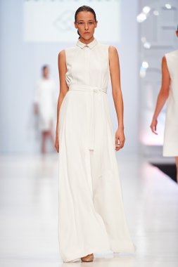 A model walks on the NATALIA GART catwalk