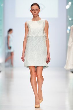 A model walks on the NATALIA GART catwalk