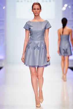A model walks on the NATALIA GART catwalk