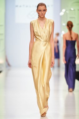 A model walks on the NATALIA GART catwalk