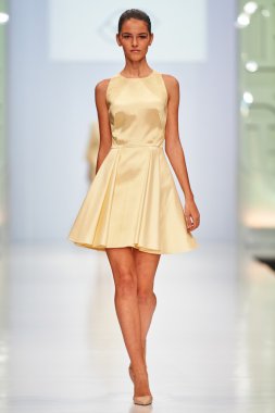 A model walks on the NATALIA GART catwalk