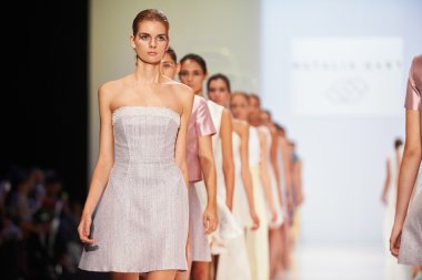 A model walks on the NATALIA GART catwalk